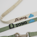 Two dog leashes with 'Disney' and 'Zong' branding on a light background