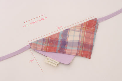 Plaid fabric triangle with purple strap and measurements on a light background